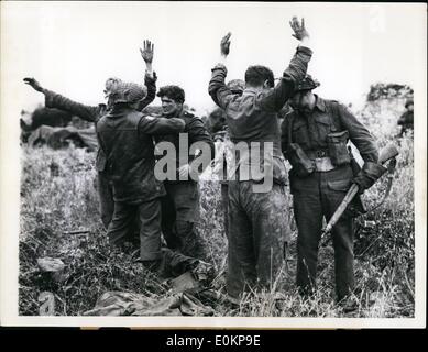 Jul. 07, 1944 - German Youths Taken Prisoner In France: Canadian Soldiers search youthful German prisoners who surrendered in the village of Gruchy, in Normandy, France, after British artillery had blasted the place while advancing on the city of Cean. Some of the prisoners captured during this action were no older than 18. Stock Photo