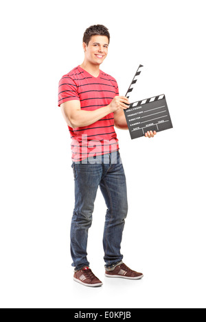 Full length portrait of a casual man holding an open movie clap Stock Photo