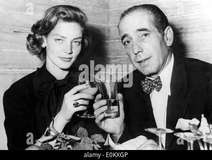 Humphrey Bogart toasting his wife Lauren Bacall Stock Photo