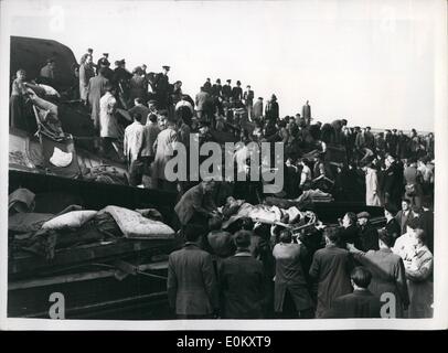 Oct. 10, 1952 - Many casualties Feared in Triple-Train crash in London. Disaster at Harrow: Three trains in the Night St to London - another express and a local train orshed at Harrow and Wealdstone Station this morning. One of the trains ploughed into the platform. A big death roll is feared. Photo shows The scene as workers search for victims and clear the wreckage after the disaster at Harrow this morning. Stock Photo