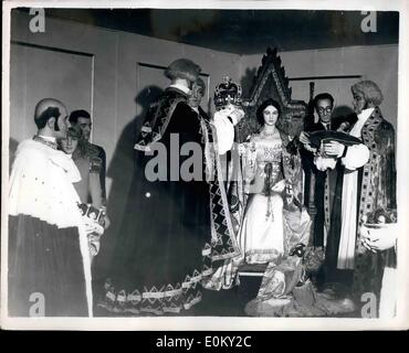 Sep. 09, 1952 - Pre-view of Birmingham ideal home exhibition: The coronation of Queen Victoria seen during yesterday's preview of the Birmingham Ideal Home Exhibition. Many of the dresses and robes seen in the picture will be used in the Coronation of Queen Elizabeth next year. Jack Johnson, 50-year old employee of a London firm of theatrical cosumiers is seen making adjustments. Stock Photo