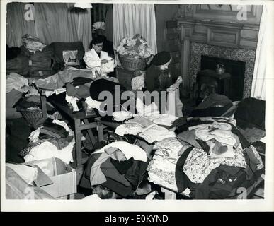 Feb. 02, 1953 - CLOTHING GIFTS FOR FLOOD VICTIMS. SCENE AT W.V.S. HEAD HEADQUARTERS IN LONDON. Gifts of clothing began to arrive at the W.V.S.Headquarters, Eton Square, London this morning - for victims of the floods. Keystone Photo Shows:- The scene as W.V.S. workers sort out the gifts of clothing for despatch to the flood centres - at Eaton Square, this morning. Stock Photo