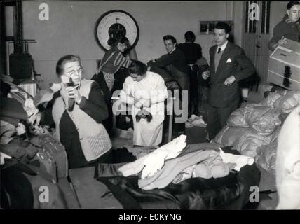 Feb. 02, 1953 - French People Respond To Appeal For Aid To Dutch Flood Victims Clothing, bedsheets and blankets being sorted out at a K.L.M. office in Paris where thousands of parcels for Dutch flood victims are received daily. Stock Photo