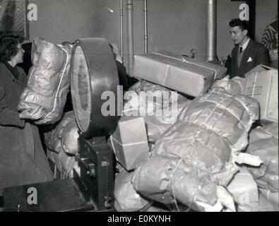 Feb. 02, 1953 - French people respond to appeal for aid to Dutch flood victims: Clothing, bedsheets and blankets being sorted out at a K.L.M. office in Paris where thousands of Parcels for dutch flood victims are received daily. Stock Photo