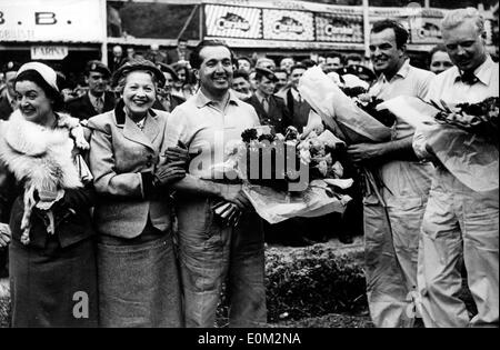 Apr 07, 1953; Pau, France; World Champion ALBERTO ASCARI won for the second time the Grand prix of Pau breaking records. The picture shows (from R-L), the second place, who was the British HAWTHORN, the third HARRY SHELL form the U.S. and the first one Ascari next to Madame BOURNAC, wife of the President of the A.C.B.B. and Madame DELAUNAY PREFETE after Ascari's victory. Stock Photo