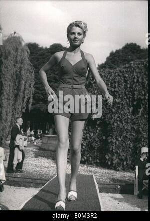 May 05, 1953 - Paris Mannequins model beach fashion. one of the bathing costumes displayed by a Paris mannequin at Le doyen's, the fashionable champs - Elysee restaurant, Paris, today. Stock Photo
