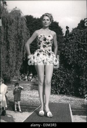 May 05, 1953 - Paris Mannequins model beach fashion. one of the bathing costumes displayed by a Paris mannequin at Le doyen's, the fashionable champs - Elysee restaurant, Paris, today. Stock Photo
