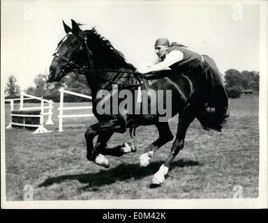 May 05, 1953 - Household Cavalry rehearse a ctivity ride. : Members of the Household Cavalry were rehearsing their Activity Ride for the Royal Tournament, Combermere Barracks, Windsor today. Photo shows Thompson, of the Royal Horse Guards, seen trick-riding on horseback, during today's rehearsal at Windsor. Stock Photo