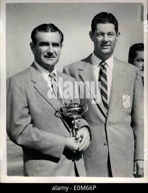 Sep. 09, 1953 - American Ryder Cup Golfers Arrive. Holding the Cup: The United States Ryder Cup Golf Team which is to compete against England at Wentworth Golf Course Ã¢â‚¬â€œarrived at London Airport this morning. Photo shows Lloyd Mangrum and Cary Middlecoff with the Ryder Cup at London Airport today. Stock Photo