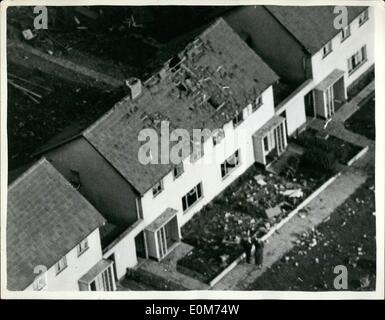 Oct. 10, 1953 - More than thirty houses damaged by Meteor jet crash at Ipswich: A meteor jet fighter crashed on a new housing estate at Ipswich today. More than 30 houses were damaged. Scores of children playing in the streets fled as debris showered down. Many people up after plunging into a garden at the back of houses in Moore road, in the center of the thickly populated estate. Photo Shows Aerial view of some of the damage after the crash. Stock Photo