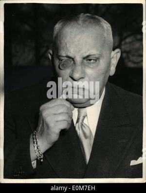 Jan. 01, 1954 - Erich Von Stroheim Holds A Press Conference Make-Shift Monocle: Erich Von Stroheim - the monocled, bullying Prussian of pre-war films - who arrived in London this morning for a twelve weck season of his film at the National Film Theatre - hedl a press conference at the Savoy Hotel this afternoon. Photo shows Erich Von Stroheim hold a 2/6d. piece in his eye - as he used to do with his famous monocle - during the press conference today. Stock Photo