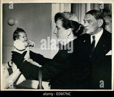 Jan. 01, 1954 - New French President And Wife Visit Paris Hospitals. Photo shows Watched by her husband, M. Rene Coty, the new French President, MME. Coty holds a tiny tot, when they visited the Laribosiere Maternity Home, during their tour of Paris Hospitals. Stock Photo