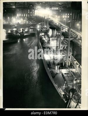 Jan. 01, 1954 - Spanish Cargo Vessel Rams London Bridge: Thousands of homeward bound City workers stopped on their way home this evening to each efforts to refloat the 487 feet Spanish cargo vessel ''Monte Uriquiola'' (7,723-tons) which jammed one of the South Bank buttresses of London Bridge as she was staring out on a 14 days round cruise to the Canary Islands. The ship was preparing to leave her berth and had cast off when the wind and the incoming tide slowed her round and brought her broadside against the bridge Stock Photo