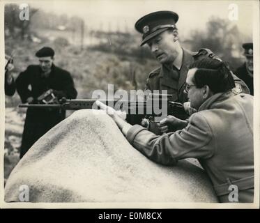 Feb. 02, 1954 - MP's Test the new Belgian Rifle : A number of M.P's were invited by the war office to fire the new Belgian rifle, F.N.0.30, on the Army range at Mill Hill today. Photo shows Mr. Woodrow Wyatt, M.P., had the gun loaded for him - by an Army instructor, at Miss Hill today. Stock Photo