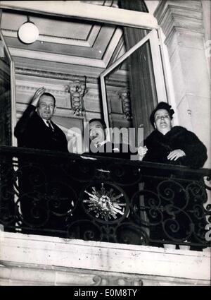 Dec. 24, 1953 - Mr. Rene Coty elected President of the French Republic: Mr. Rene Coty (left) acknowledges the cheers of the crowd from the balcony of the prefecture at Versailles late last night. His wife is at right and Prime Minister Joseph Laniel in centre. Stock Photo