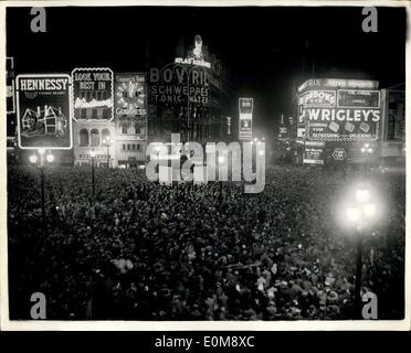 Jan. 01, 1954 - Crowd Celebrate The New Year In Piccadilly: Photo shows Part of the immense crowd which greeted the coming of the New Year in London's Piccadilly Circus last night. Eros can be seen in the centre boarded up to keep the revelers from climbing on the famous statue. Stock Photo