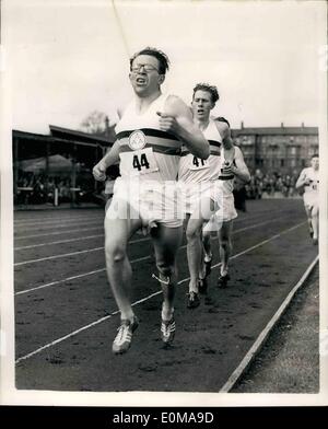 May 05, 1954 - Roger Bannistar Does It. Rune Mile In Under Four Minutes; Britain's Roger Bannister has done it. Last night he ran the fabulous four-,minute ,o;e. a feat which the world's athletes have been trying to achieve for years. His time was three minutes 59.4 seconds. As he passed the post at Oxford's Ifflay-road track he was swept up in a mass of cheering, shouting spectators. Photo Shows The world record mile lap by lap at Oxford last night. In picture No. 1 Chris Brasher's agonized expression as he makes the pace at the end of the first lap shows his anxiety to keep to schedule Stock Photo