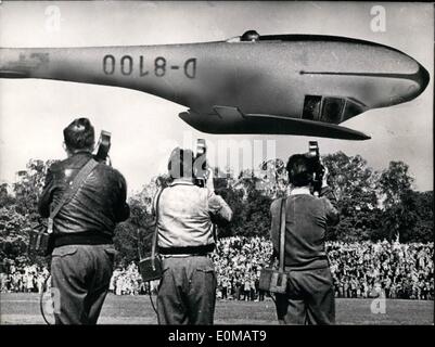 May 05, 1954 - In a high of eight meters... the glider Albert Falderbaum flew in a back-flight above about 5000 spectators in Essen. His artistic flights had been the sensation of the flying-day on the air-field in Essen. Never before the three men of the news-reel made such pictures. Stock Photo