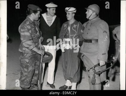 Jun. 06, 1954 - The four but not of a kind: A paratrooper, a sailor, an Algerian soldier and an ex-service man wearing the uniform of World's War No. 1 meet together on the track of the Palais Des Sports, Paris during a rehearsal for the army show to start tomorrow. Stock Photo