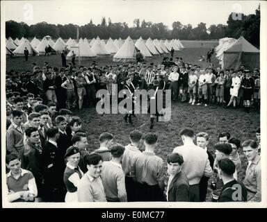 Aug. 08, 1954 - Founder's Camp On The Playing Field's of Eton. The great International Camp in celebration of the Centenary of the birth of Sir William Smith, Founder of the Boys Brigade - is being formally opened on the playing fields of Eton, where more than 2,000 members of the Boys Brigade assembled. Keystone Photo Shows:- Members of the Scottish Boys Brigade playing and performing a sword dance for other members gathered at the camp. Stock Photo