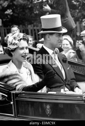 Queen Elizabeth II and Prince Philip driving through Ascot Stock Photo