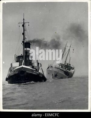 Aug. 21, 1954 - Dutch Ship arrives in the Mersey with a list of 30 degrees: Battered by gales in a ten day trip from Sweden, the Dutch motor vessel Han arrived in the Hersey, Liverpool, yesterday, with a list of more than 30 degrees. The list was caused by her deck cargo of timber being swollen by the heavy rain which came with the gals. The ship carries a crew of 11 including the young wife of the Captain L. Bergsma, who has traveled thousands of miles with him on his voyages. Stock Photo