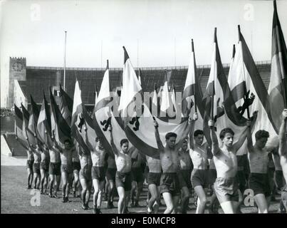 Sep. 03, 1954 - Pictured are men from the Berlin Police Units waving flags as they march into the Olympic Stadium. They were taking part in the annual Police Sports Festival. Stock Photo