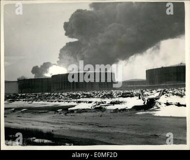 Feb. 02, 1955 - Exploding tanks shake fifteen mine countryside: An army of 200 firemen battled among exploding tanks of napthalene today to prevent fire destroying the mammoth Shellhaven on the Thames. A mass of flames as high as the dome of St. Paul's Cathedral roared upwards as red hot tanks exploded. The first tank exploded at 4 a.m. and one of the tanks which went up contained 900 tons of high grade spirit. Photo shows the Pall of smoke which roars into the sky following the explosion at Shellhaven Oil Refinery today. Stock Photo