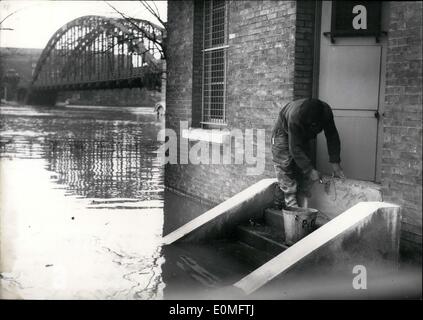 Jan. 01, 1955 - Floods in Paris: A Parisian living in a house on the banks of the Seine protects his the basement with a layer of concrete. Stock Photo