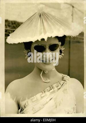 Jun. 06, 1955 - Wimbledon - third day.. The 'Umbrella' hat and Sunflower Ear-rings: Photo shows Mrs. Pamela Goode of Hampstead wore a unique Rede and White 'Umbrella' hat - and straw sunflower ear-rings - when she arrived for the third day of the Wimbledon Tournament today. Stock Photo