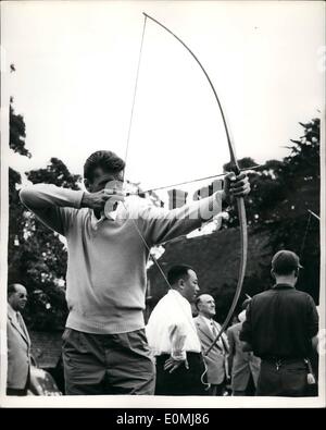 Jun. 06, 1955 - Wimbledon Stars Take A Trip On The River. Visit To The National Recreation Centre: Many of the stars of the present Wimbledon Tournament - spent the day at the National Recreation center, Bisham Abbey, Berkshire yesterday. Photo Shows: Italian tennis competitor Sirola takes aim during a spell of archery - at Bisham Abbey. Stock Photo