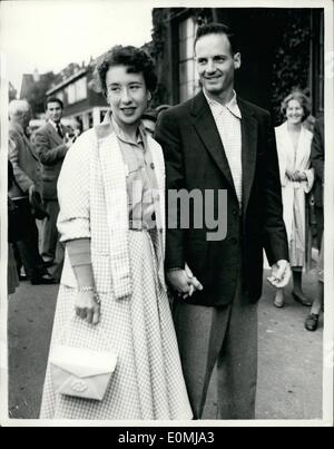 Jun. 06, 1955 - Arriving for opening of Wimbledon tournament. ''Little Mo'' and husband attend. Photo shows Maureen Connolly the champion who is not defending her title - arrives with her husband Mr. Norman Brinker - for the opening of the 1955 tournament at Wimbledon this afternoon . ''Little Mo'' is to report on the tournament Stock Photo