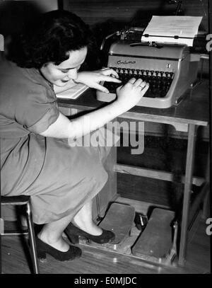 Woman demonstrates typewriter Stock Photo