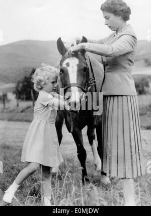 Queen Elizabeth II and Princess Anne with a pony at Balmoral Castle Stock Photo