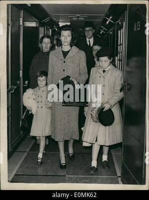 Oct. 10, 1955 - Ali Khan Meets Rita Hayworth on Her Arrival In Paris: Film actress Rita Hayworth was hardly in Paris n hour last night ex-husband Aly Khan was calling on her t &pound;25-a-day suite at the Ritz. She had arrived from New York earlier with her daughters, six-year-old Yasmin, and Rebbecca,m the ten-year-old daughter of her marriage to Orsen Wells, She has come to Paris to 1st her daughter Yasmin live with Aly for six weeks. Photo shows Rita Hayworth lands at Cherbourg with her daughters Yasmin, 6, and Rebecca, 10. Stock Photo