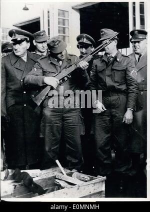 Jan. 11, 1956 - American weapons for the Germans... American officers presented German soldiers with supply of hand weapons in Andernach. It was the first supply of Browning quickfire weapons. Pictured is a German officer as he checks the weapons. On the far right is an American officer. Stock Photo