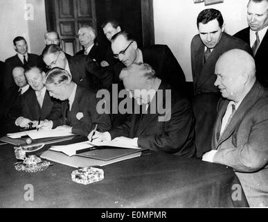 Prime Minister Nikita Khrushchev and others signing documents Stock Photo