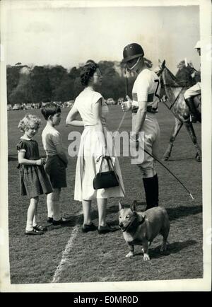 May 05, 1956 - The Duke of Edinburgh plays Polo at Windsor... The Queen and Royal Children attend.: The Duke of Edinburgh played polo on Smith's lawn in Windsor Great Park this afternoon. The Queen  the two Royal children watched the games. Photo shows the Queen goes over to chat to the Duke between chukkers accompanied by Prince Charles and Princess Anne. Stock Photo