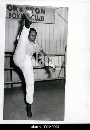 May 05, 1956 - Archie Moore Goes Into Training At Windsor No Doubt how seriously Archie Moore takes his training his training as the world light heavywieght shows a neat line in high-kicking at Windsor training camp. Stock Photo