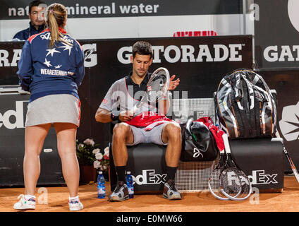 Novak Djokovic testing new racquet in game against Phillip Kohlscheiber in third round tie in the ATP international in Rome. Stock Photo