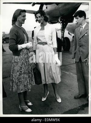 Sep. 09, 1956 - Duchess of Kent and daughter arrive home from Rome to a Breezy Airport.: Photo shows there was a stiff breeze blowing at London Airport yesterday, Windy enough to ruffle Princess Alexandra's hair; breezy enough to make the Duchess of Kent wear a headscarf. They flew into London yesterday from Rome with Prince Michael after a four-week holiday in Italy. Stock Photo