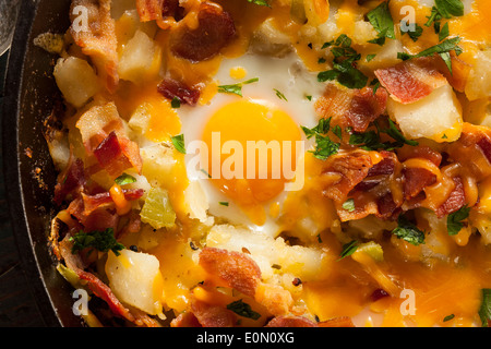 Homemade Hearty Breakfast Skillet with Eggs Potatoes and Bacon Stock Photo