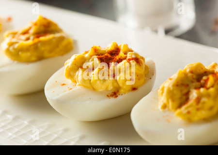 Healthy Deviled Eggs as an Appetizer with Paprika Stock Photo
