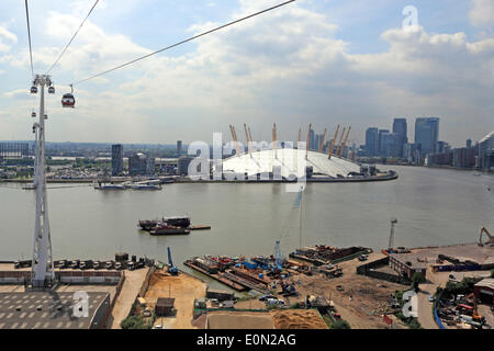 Greenwich, London, England, UK. 16th May 2014. It was a warm and sunny day across much of the UK. Here in London the Emirates Air Line cable car is taking passengers on a ride 295 feet over the River Thames, giving a wonderful view across the city. Credit:  Julia Gavin/Alamy Live News Stock Photo