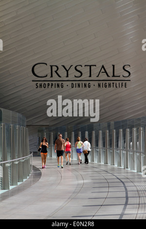 Pedestrians  on a walkway outside of the Crystals luxury shopping dining and nightlife  center in Las Vegas Nevada Stock Photo