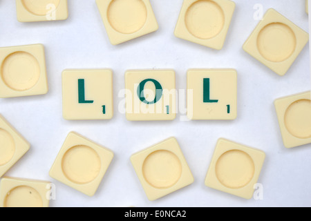 Scrabble tiles reading out the words LOL (laugh out loud). Stock Photo
