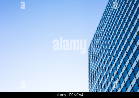 Exterior of building - abstract concept; skyscraper from down below against blue sky Stock Photo