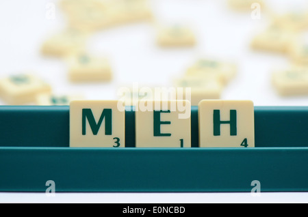 Scrabble tiles reading out the words MEH Stock Photo