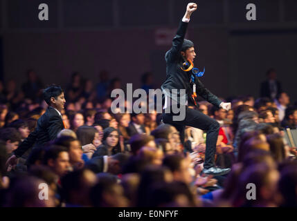 (140517) -- LOS ANGELES, May 17, 2014 (Xinhua) -- Two award winners run to the stage during the award ceremony of Intel International Science and Engineering Fair (Intel ISEF) in Los Angeles, United States, May 16, 2014. Nearly 1,800 of the world's most promising young scientists, engineers and mathematicians gathered in Los Angeles from May 11 to May 16, to participate in the world's largest pre-college science competition, the 2014 Intel International Science and Engineering Fair. (Xinhua/Yang Lei) (djj) Stock Photo