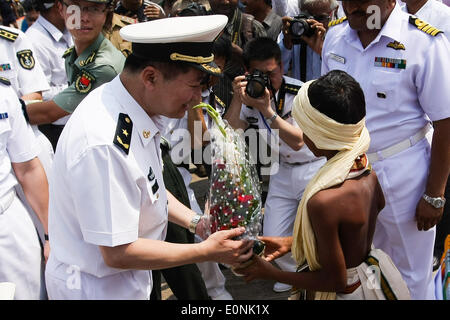 (140517) -- VISAKHAPATNAM, May 17, 2014 (Xinhua) -- Command of China's missile frigate Weifang Han Xiaohu (L) receives flowers at port of Visakhapatnam in east Indian on May 17, 2014. Chinese Navy training vessel Zhenghe and missile frigate Weifang arrived in port of Visakhapatnam in east Indian and started a 4-day visit on Saturday. (Xinhua/Zheng Huansong) (djj) Stock Photo